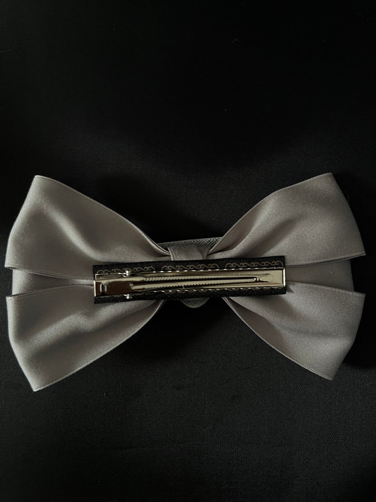 HAIR Bow grey - triangle logo