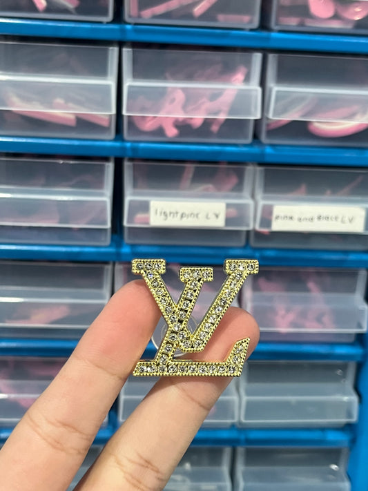 Gold L v metal charm