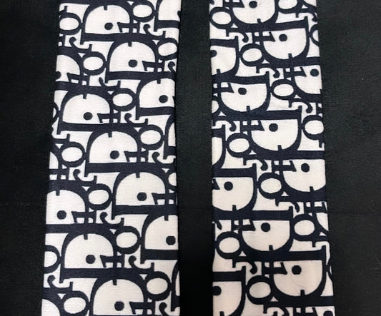 White and black pattern D straps
